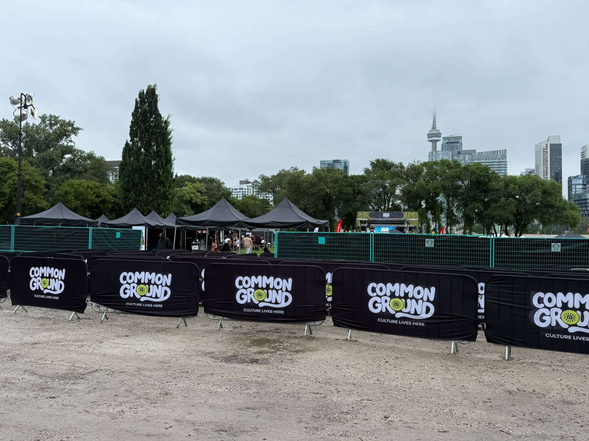 Temporary fencing and crowd-control barriers installed at an outdoor event